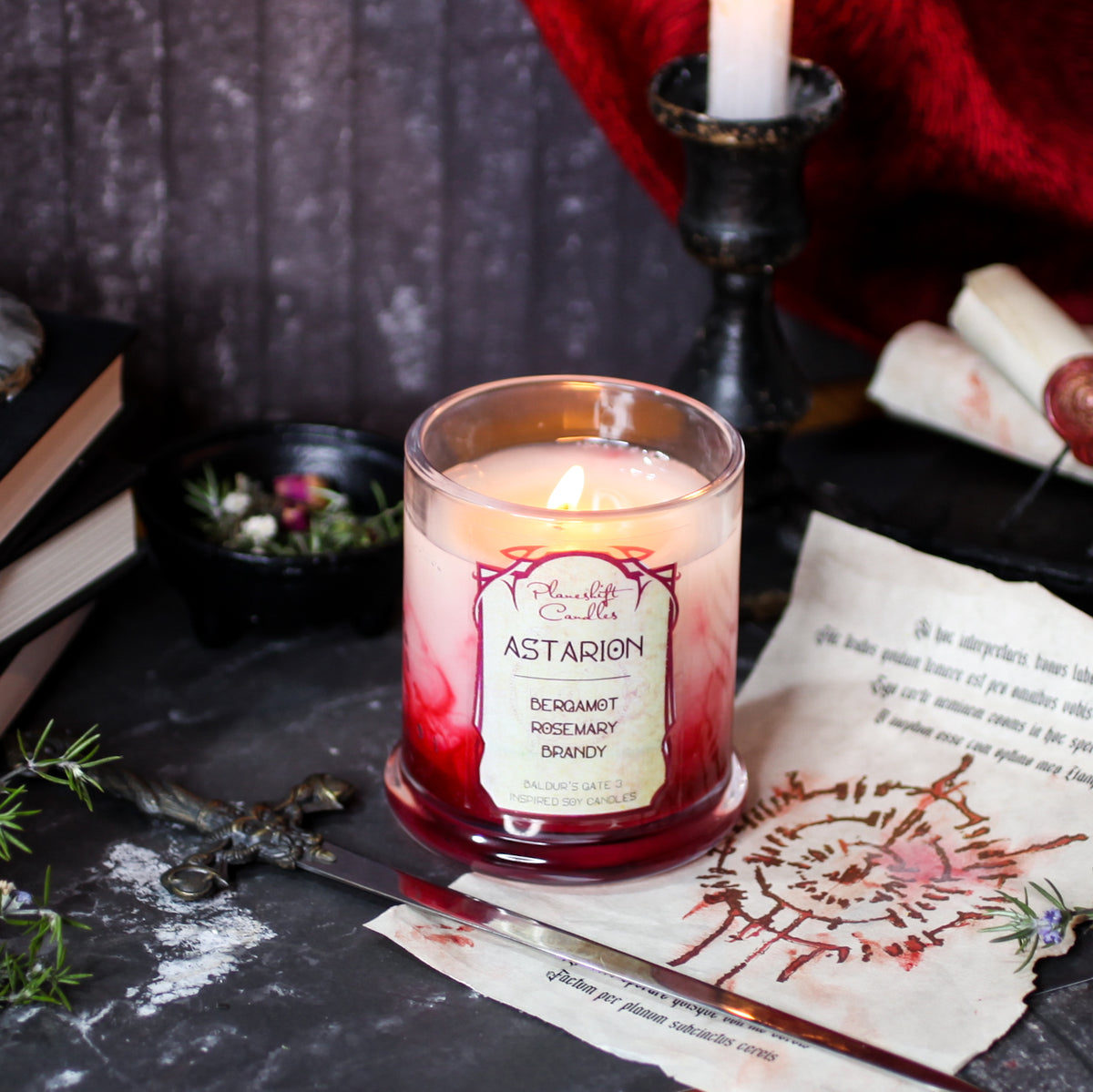 Picture of a white soy wax candle with blood red swirls running through it. The label reads "Astarion - Bergamot, Rosemary, Brandy. Baldur's Gate 3 Inspired Soy Candle - Planeshift Candles."