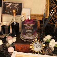 Load image into Gallery viewer, A lit burgundy coloured wax rose sits on black, grey and burgundy tinted candle. The label reads "Planeshift Candles - Esquie - Marshmallow, mulled wine, cocoa- Clair Obscur expedition 33 inspired soy candle"
