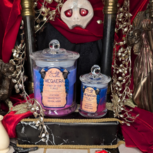 Load image into Gallery viewer, Large and Small Megaera candles in blue and pink wax poured in clear glass jars with lids.