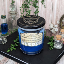 Load image into Gallery viewer, A two tone blue custom candle for the character "Jarrah Ingensra" in a glass jar with wooden etched Planeshift Candles lid.
