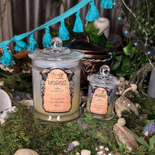 Load image into Gallery viewer, Large and Small Moros candles in grey and ivory wax poured in clear glass jars with lids.
