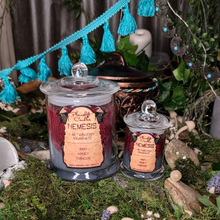 Load image into Gallery viewer, Large and Small Nemesis candles in maroon and silver wax poured in clear glass jars with lids.
