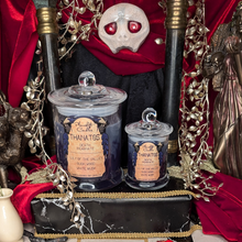 Load image into Gallery viewer, Large and Small Thanatos candles of grey and purple wax in clear glass jars with lids.
