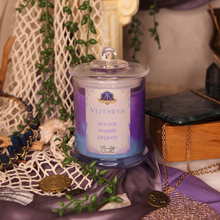 Load image into Gallery viewer, Vilithryn candle with decorative elements on a textured surface
